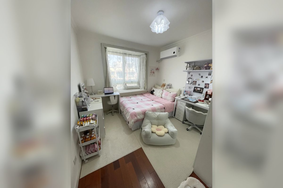 Compact bedroom with repeated small storage zones near a bed and desk.